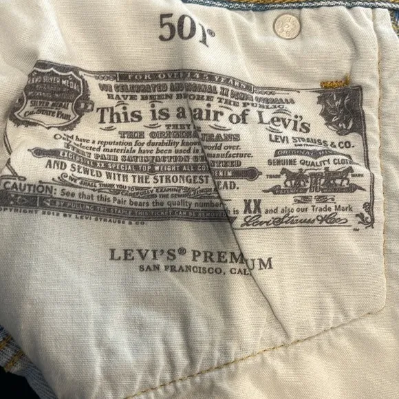 Levi’s 501 denim Buttonfly denim shorts. High-rise, intentionally, distressed.